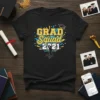 Black t-shirt with "GRAD Squad 2021" in yellow and blue text, featuring a jumping silhouette and confetti graphic