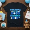 Grandma of the Boss Birthday Boy text design with baby footprints, bow, gift, and rattle icons on a navy t-shirt