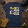 Grandpa The Man The Myth The Welder Legend text with a welder graphic on a navy t-shirt