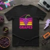 Black t-shirt featuring a colorful retro design with the word GRAPES and a bunch of purple grapes