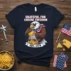 Grateful For Cheese Freedom t-shirt design with patriotic eagle grating cheese on nachos, est. 1776