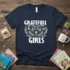 Navy t-shirt with white text "Gratefull for my Girls" inside a floral heart design