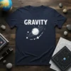 Navy t-shirt with the word GRAVITY in white bold text and a stylized illustration of a planet with orbiting rings