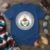 Great Seal of the Navajo Nation text and emblem graphic on a blue t-shirt, featuring mountains, sun, and animals