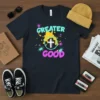 Greater Good Christian t-shirt with white cross inside a circle, surrounded by colorful splatters and stars