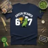 Green Beaned By 67 T-Shirt featuring a cartoon green bean character holding a trophy and wearing a chef's hat, with