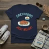 Navy t-shirt with "GREYHOUND JUST RELAX!" text and a sleeping greyhound graphic