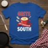Blue t-shirt with "GRITS GIRLS RAISED IN THE SOUTH" text and a graphic of a red mug of grits with