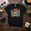 Groovy Nini text with retro mushrooms, butterflies, and peace signs on a black t-shirt