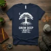 Grow Deep Roots Stand Tall quote on a navy t-shirt with a white tree of life graphic and moon