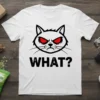 White t-shirt with a grumpy cat face and the text "WHAT?". Features bold black text and red angry eyes
