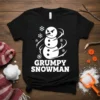 Grumpy Snowman graphic t-shirt with snowflakes and swirling wind effect