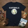 Navy t-shirt featuring the Guatemala National Emblem with white text "GUATEMALA" above the coat of arms