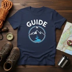 Navy t-shirt with white "GUIDE N" text above a circular graphic of mountains and a river, symbolizing adventure and navigation
