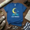 Gulf Shores t-shirt with a black and white striped lighthouse, crescent moon, and starry night sky graphic