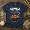 GUMBO S'il Vous Plait! text with seafood, okra, and chicken graphic on a navy t-shirt