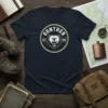 Navy t-shirt featuring the Gunther Est 1992 Bear Logo in a circular design with a roaring bear head and gold