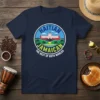 Haitian Jamaican The Best of Both Worlds t-shirt featuring a circular design with a building, palm trees, and water
