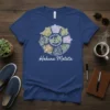 Hakuna Matata quote t-shirt with a circular graphic of people in different poses, inspired by African art and positive vibes