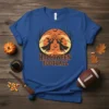Halloween Football t-shirt design featuring two witches holding a pumpkin under a crescent moon with bats and trees