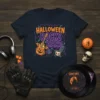Halloween Rocks Hard T-Shirt with a flaming guitar, tombstone, and skull amplifier graphic