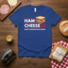 Blue t-shirt with "HAM CHEESE 20 MAKE SANDWICHES AGAIN" text and a cartoon ham and cheese sandwich graphic