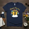 Happier Than Ever quote with a silhouette jumping for joy under a rainbow and birds, on a navy t-shirt