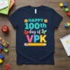 Navy blue t-shirt with "Happy 100th day of VPK" text, featuring colorful graphics like flowers, an apple, a butterfly, and