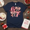 Navy blue t-shirt with "Happy 67th Birthday" text and a pink strawberry bow design
