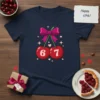 Happy 67th Cherry T-Shirt design with two red cherries, a pink bow, and the numbers 67