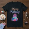 Happy Birthday T-Shirt with sparkly stacked gift boxes and a pink butterfly graphic, featuring glittery text