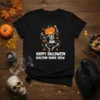 Happy Halloween Skeleton Dance Crew text with a dancing skeleton and pumpkin head graphic on a black t-shirt