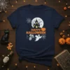 Happy Halloween t-shirt design with haunted house, ghost, skulls, and pumpkins under a full moon