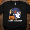 Happy Halloween t-shirt design with a black cat on a pumpkin and a friendly ghost, set against a starry night