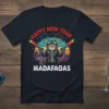 Happy New Year Madafagas t-shirt design featuring a cool cat with guns and fireworks, text "Happy New Year Madafagas"