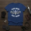 Christian t-shirt with "HARD WORK GOD'S WORK" text, featuring muscular arms lifting a barbell with a cross in the center