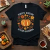 Harvest Blossom Autumn Gathering t-shirt with a central pumpkin surrounded by fall flowers and leaves