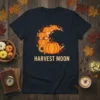 Harvest Moon t-shirt with a crescent moon filled with pumpkins and fall leaves, text below says HARVEST MOON