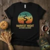 Harvest Night Autumn Equinox t-shirt design with a silhouetted twisted tree against a vintage sunset and birds in flight