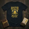 Hastur King in Yellow t-shirt design featuring a hooded figure in yellow robes and the Hastur text