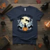 Haunted by Ghosts Crossed by Black Cats Halloween t-shirt design featuring black cats, ghosts, and a pumpkin under a full