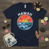 Navy t-shirt with circular Hawaii design featuring islands, ocean waves, sunset, and volcano graphic