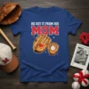 He Got It From His Mom text with baseball glove and ball graphic on a blue t-shirt