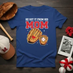 He Got It From His Mom text with baseball glove and ball graphic on a blue t-shirt
