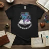 Healing With Ink & Heart t-shirt design featuring an open book, swirling ink, and a feather quill, perfect for writers