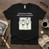 Black t-shirt with "Height Doesn't Matter When You're Lying Down" text above a graphic of two boys of different heights