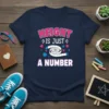 Height Is Just A Number quote on a navy t-shirt with a measuring tape graphic and pink and blue accents