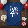 Blue t-shirt with "hello 40" in white script and bold font, featuring a small red heart with a white checkered