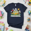 Hello Preschool text with school bus and educational icons on a navy t-shirt design