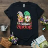 Hello Spring t-shirt design with two cute gnomes holding flowers, surrounded by floral accents